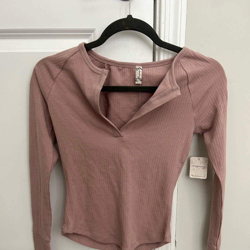 Free people long sleeve it a rose gold/ pink color